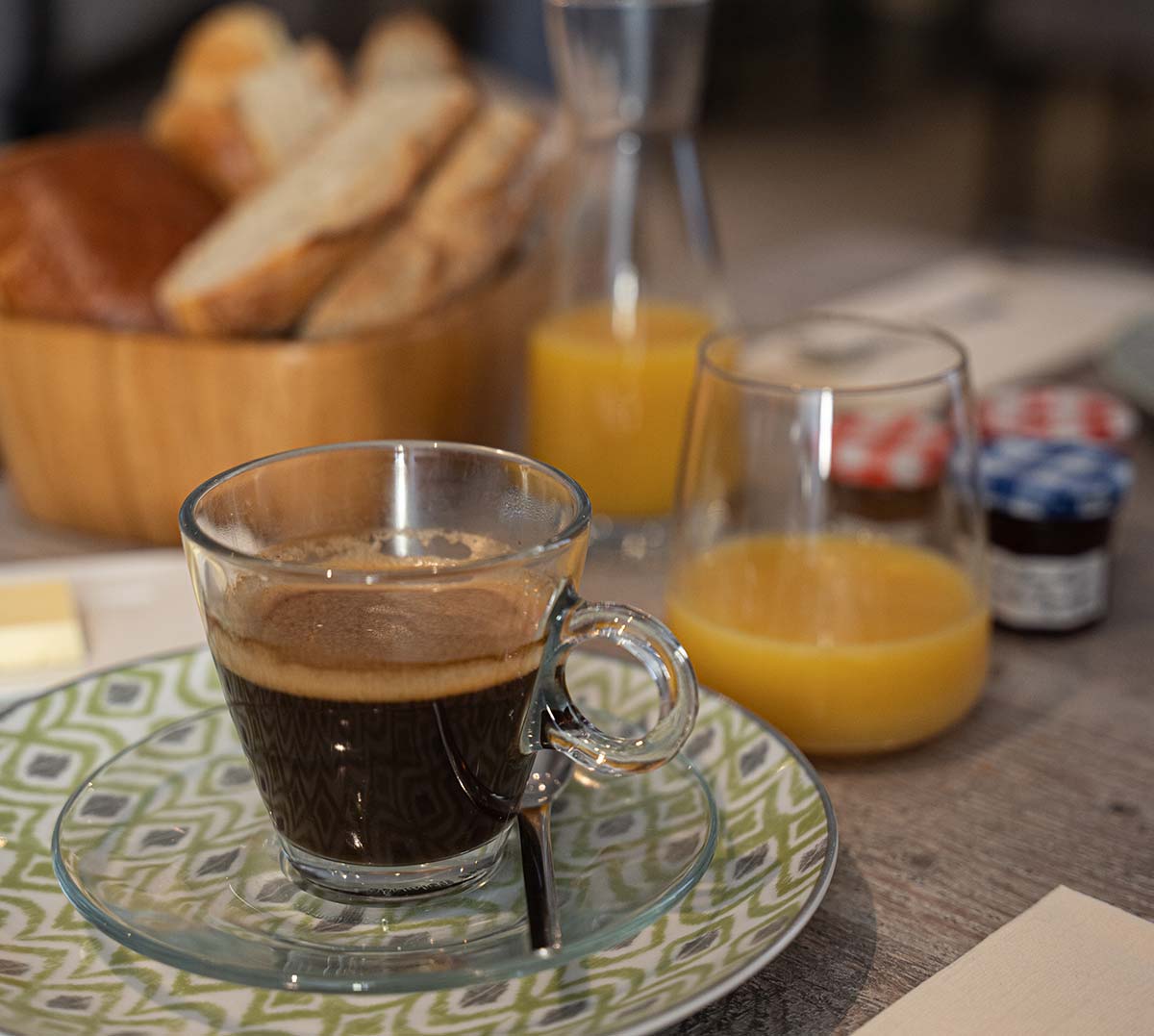 Cup of coffee and orange juice from hotel breakfast near Saintes